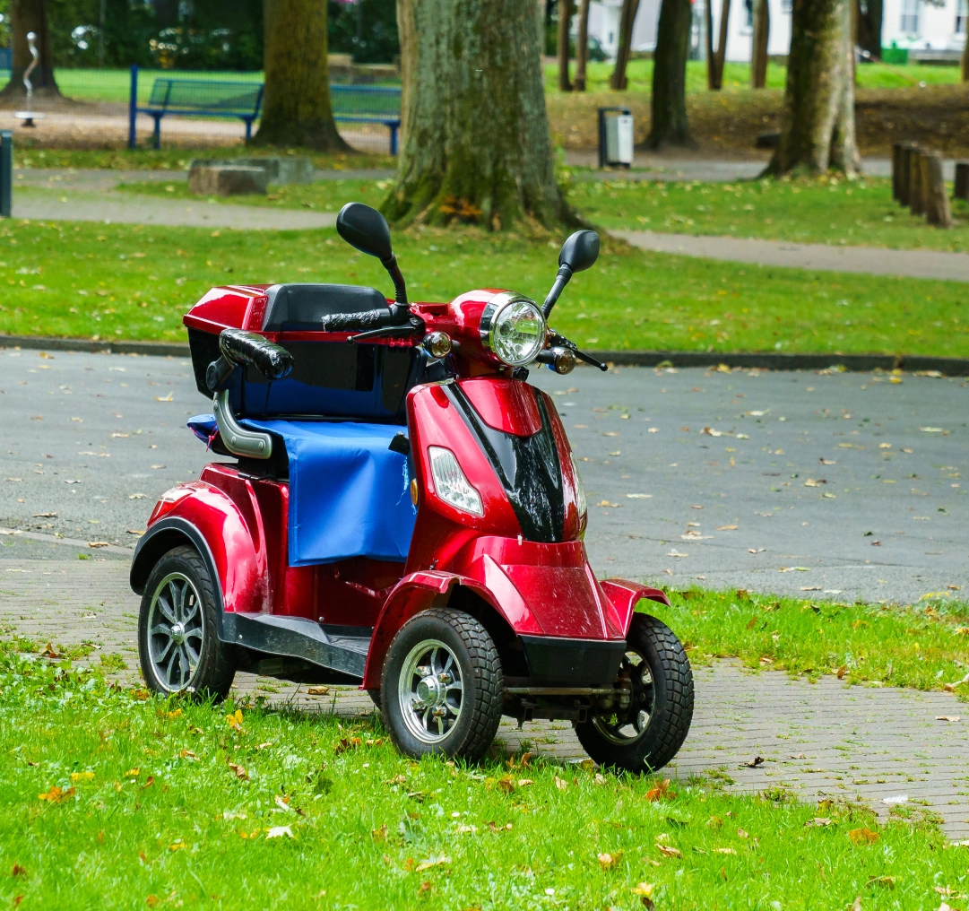 Electric scooter in grassy park area