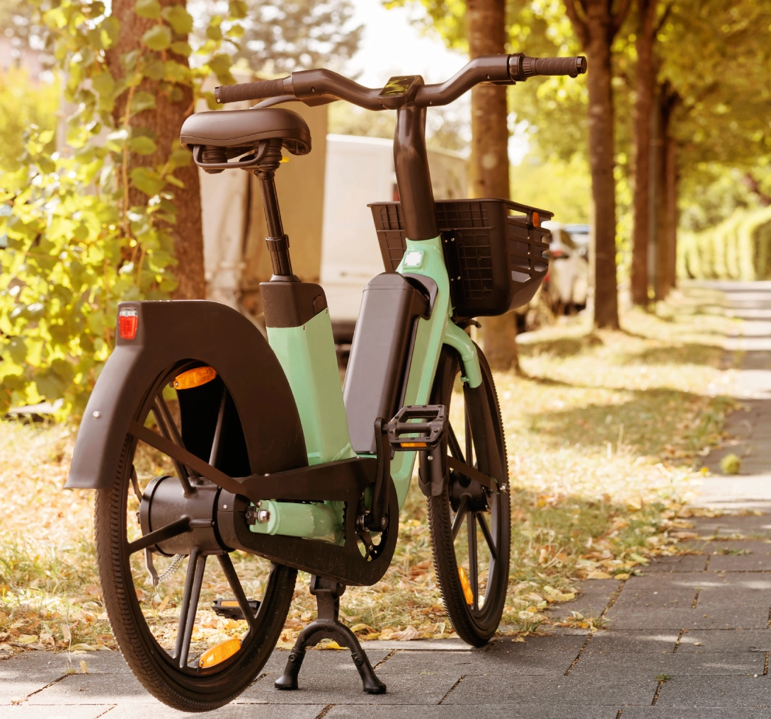 Green electric bike on a sunny path