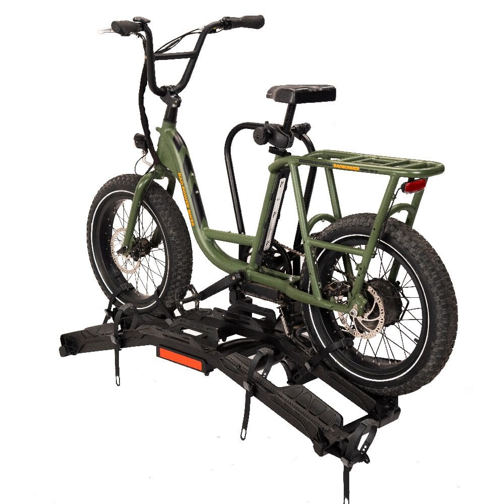 Green electric cargo bike on hitch rack