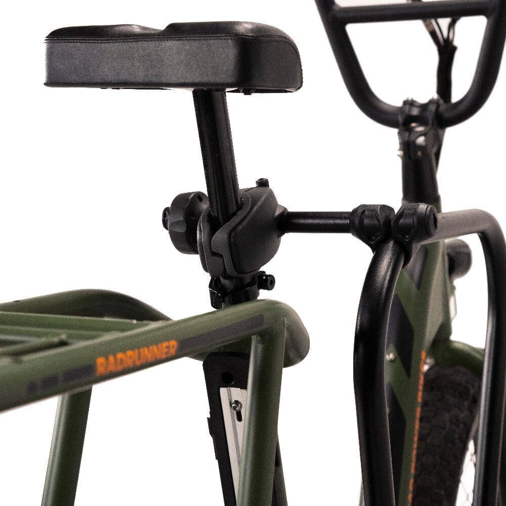 Padded rear seat on green cargo bike