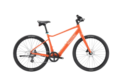 Orange Velotric electric bicycle on black background