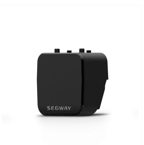 Black Segway accessory module on black background